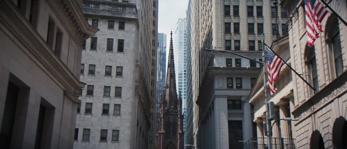 External architecture of buildings in a metropolis with a cathedral in the background