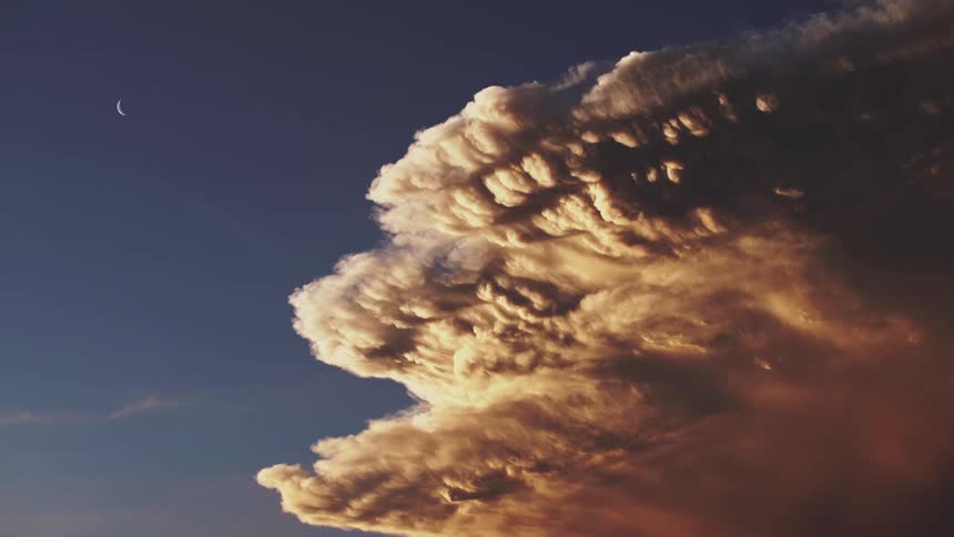 Big cloud in the sky with bright waning moon
