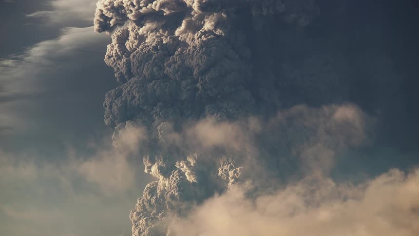 A volcanic eruption with roiling clouds