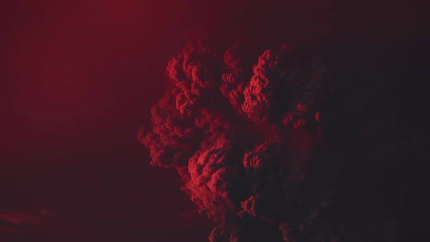 Red light shines on the smoke rising