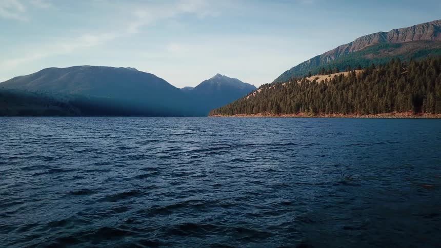 Water flows around mountainous land