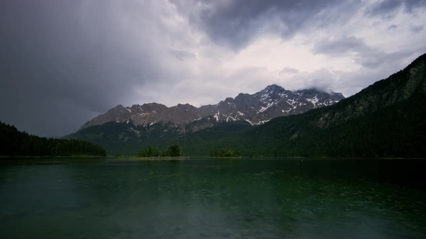 A lake lies by the mountain
