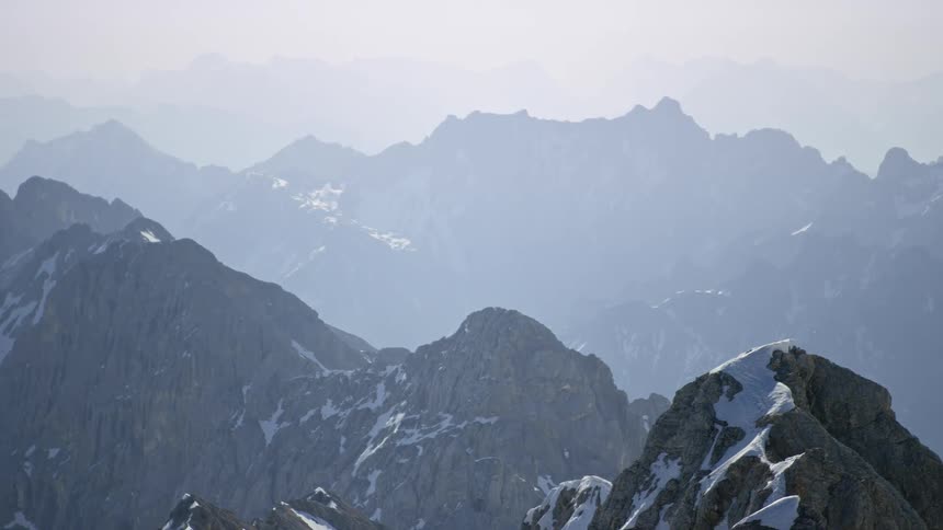 A view of a mountain with snow on top of it