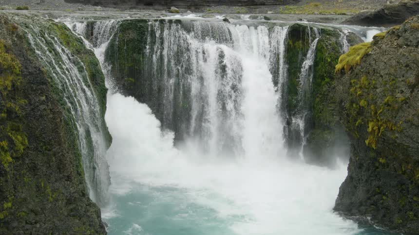 Aerial of a waterfall with clear waters during the day