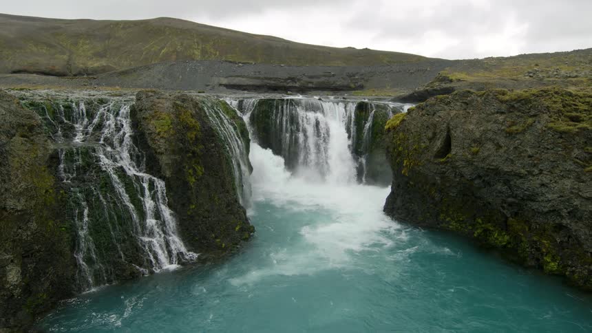 A region with some waterfalls coming out of the top of rocks
