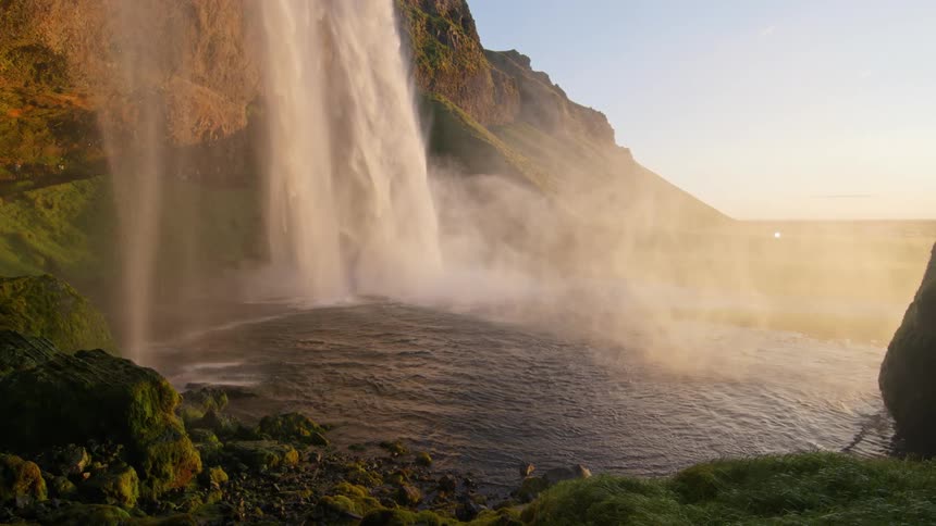 Panorama of a waterfall in a natural setting under a morning sky