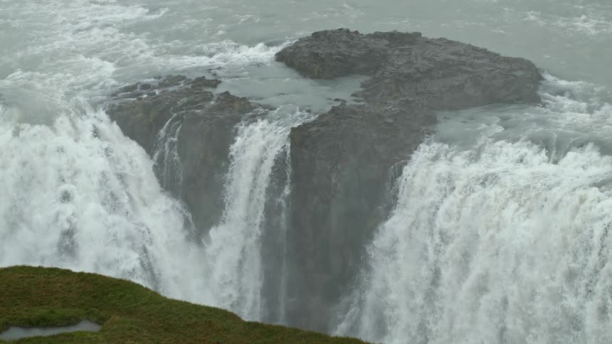White water waterfall spills over rocky ledge