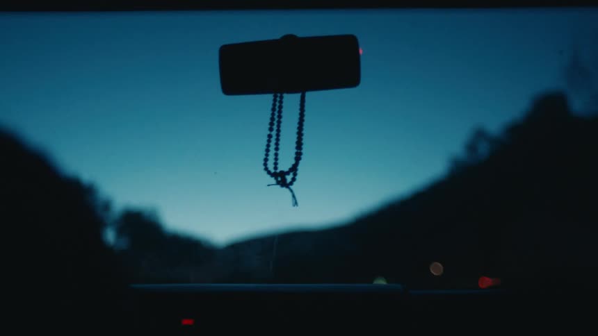 View of top rear view car inside moving at dawn