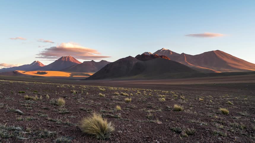 A timelapse of the sun setting over a mountain range