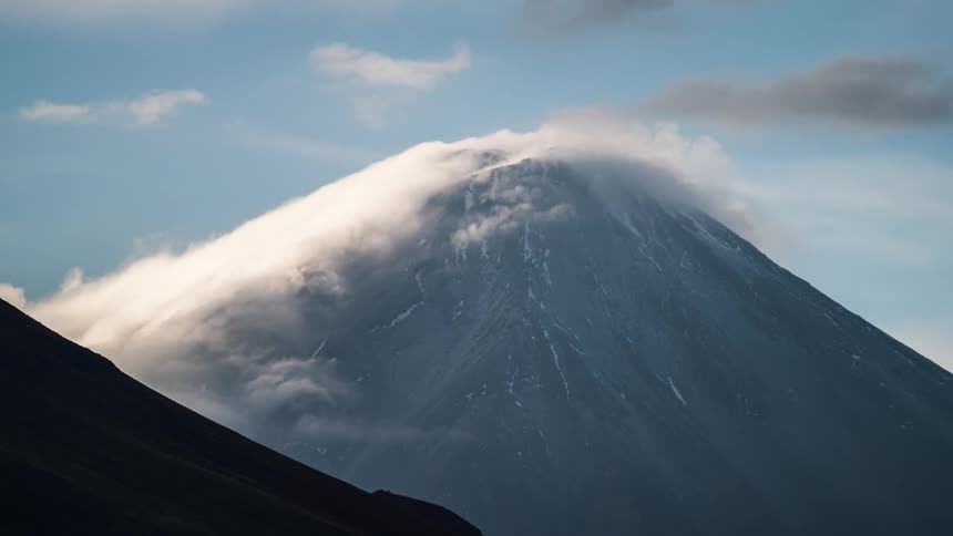 Mountain range with clouds passing in timelapse