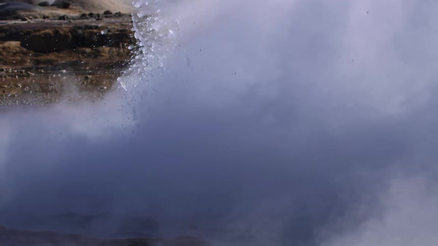 Eruption of water in the volcanic lake during the day