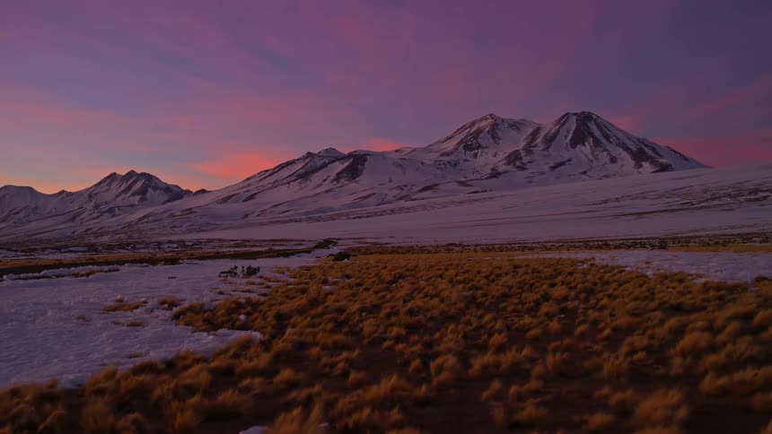 The layer of snow melting in the mountains during dawn