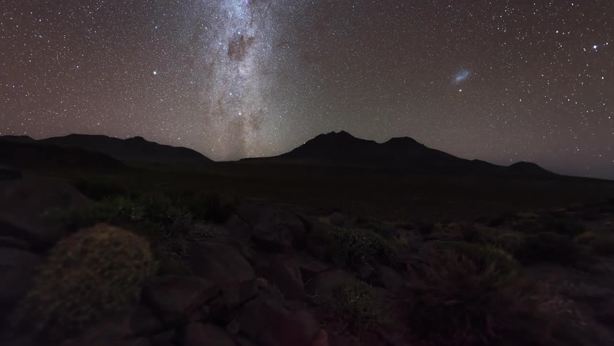 The sun sets to a sky full of stars in the valley