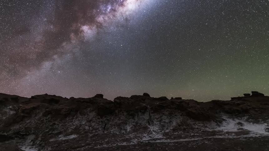 Sky with nebulas in a natural environment with snowy mountains at night