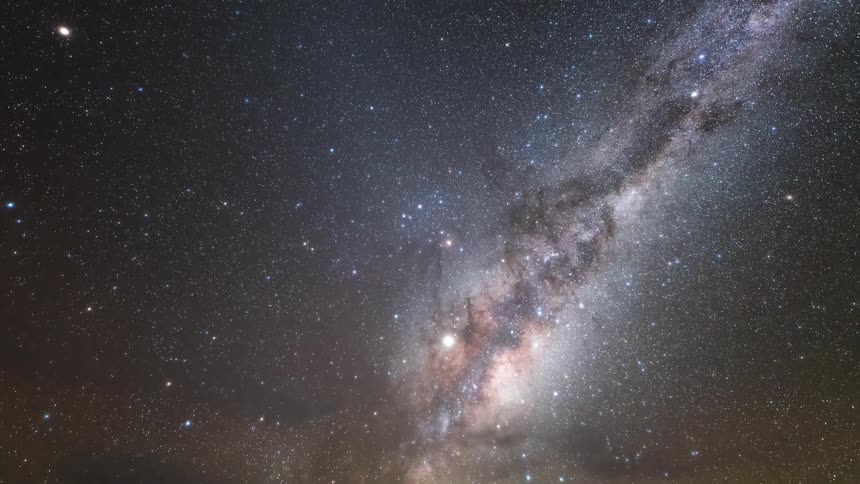A view of the milky way over some clouds