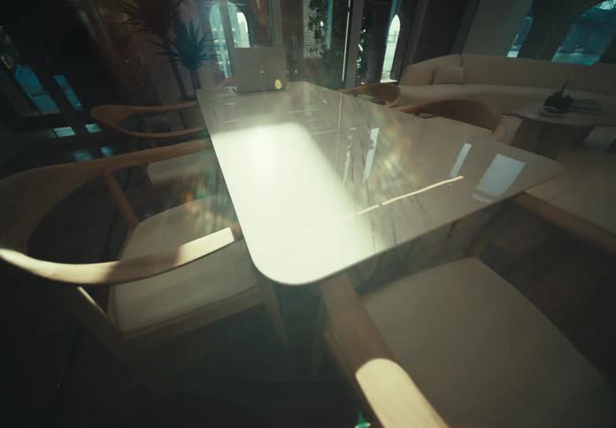 A laptop is on the dining room table