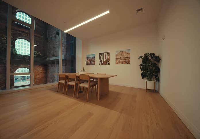 Interior architecture of a room inside a building with wooden tables