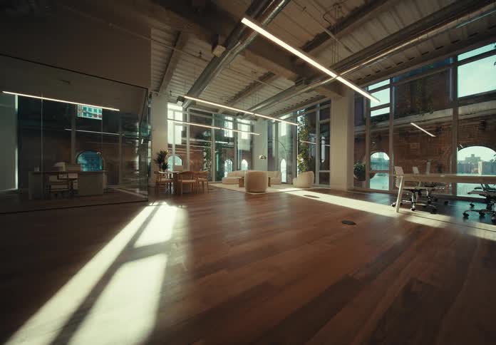 The spacious office interior with its warm wooden floor