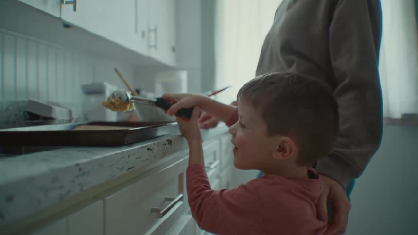 A mother and son making food