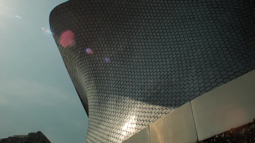 Sunlight shines on a modern building in a city