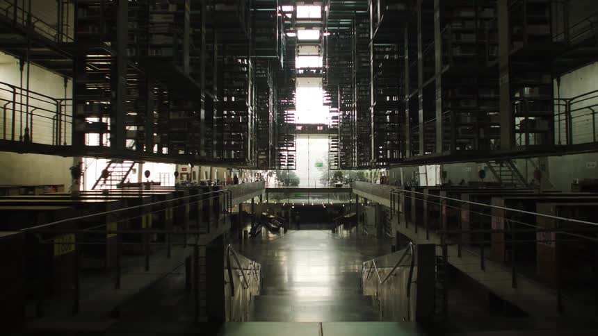 Interior view of a twostory library with tables and chairs