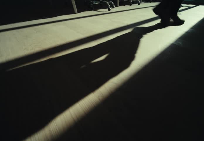 Foot of a person walking on laminate flooring
