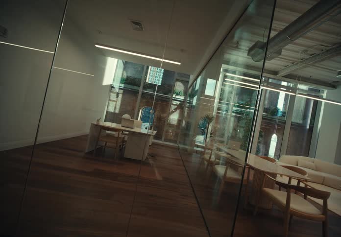 He spacious office interior with its wooden floor