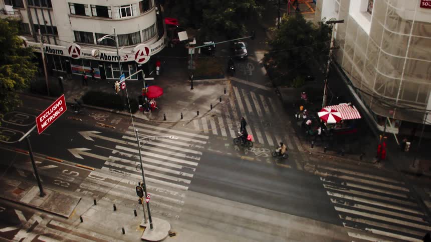 View of a street with pedestrian walkways in moving vehicles