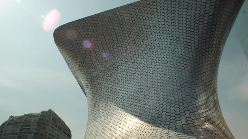 A building with modern design curved on the sides and flat at the top