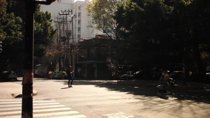 Cars and people travel in the city