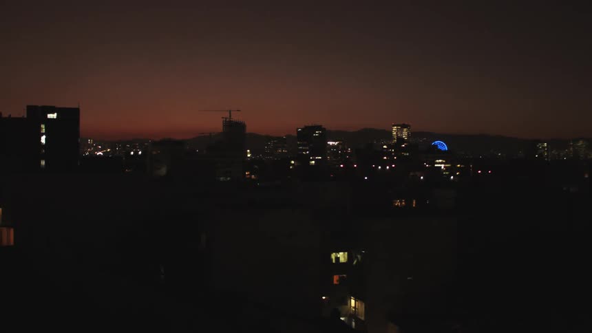 Panorama of the silhouette of buildings in a metropolis at night