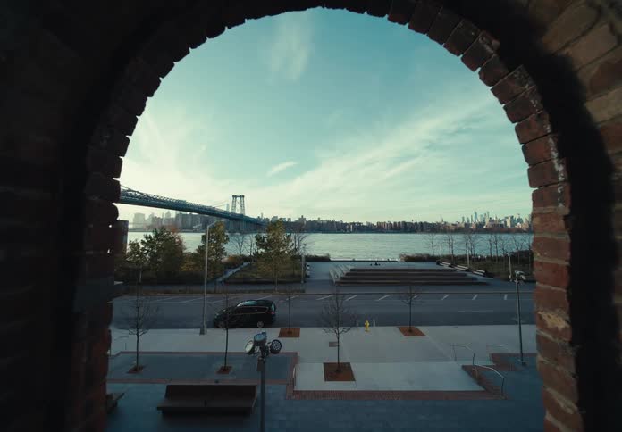 Landscape of a calm street on a morning in a metropolis with a view of the sea and a bridge