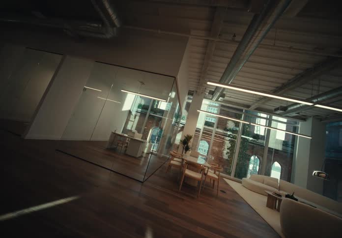 Interior design of a mirrored building with living room tables and modern decor