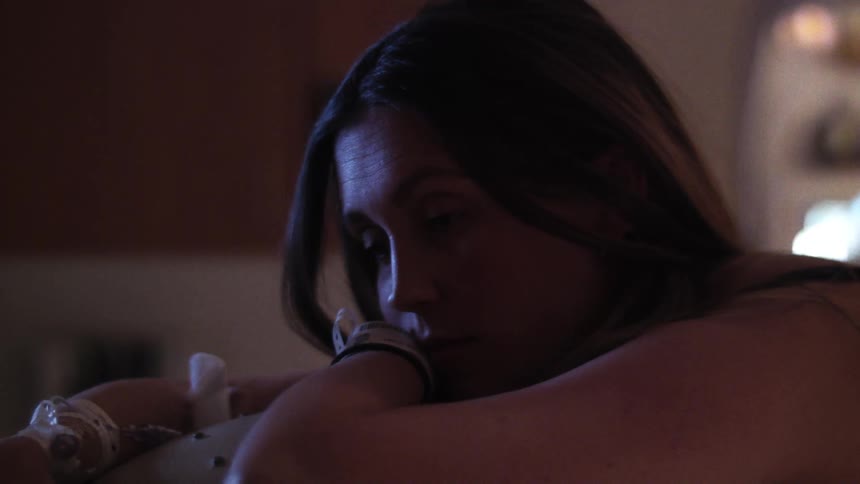 A woman is rocking and sleeping