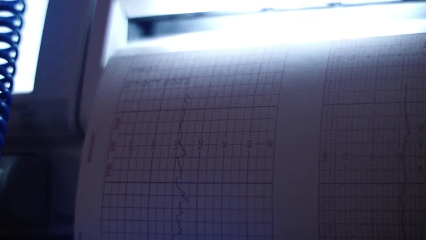 Closeup on a paper with one of the magnetics of a machine