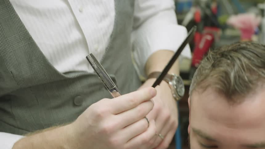 Barber cutting a man's hair