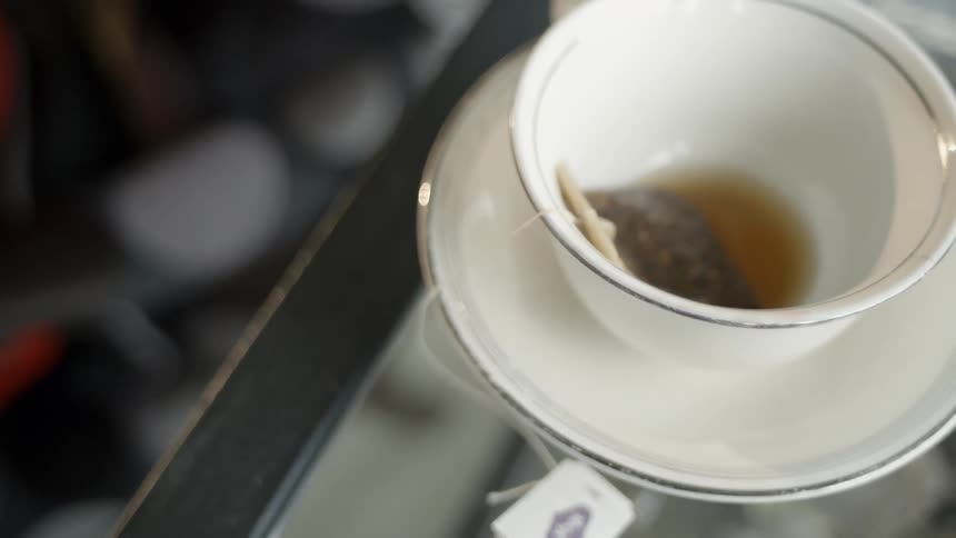 A teacup with a tea bag still in it