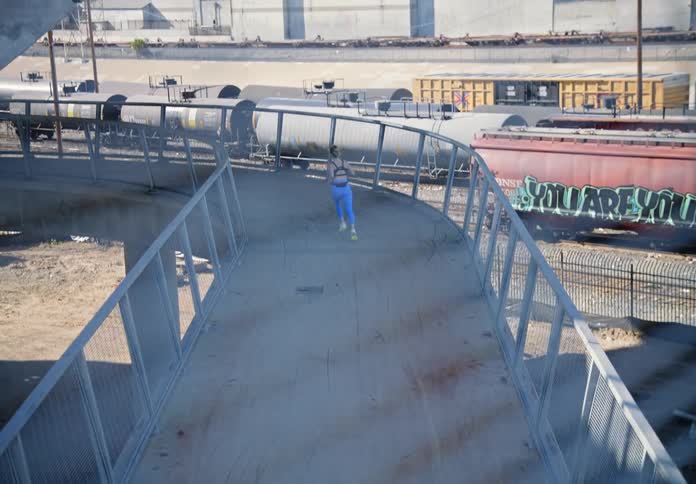 A woman running on a train bridge in a neighborhood during the day