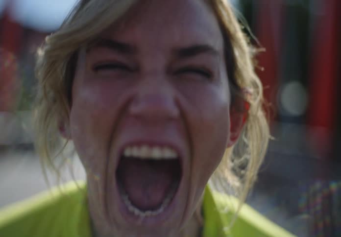 Portrait of a woman in an outdoor environment screaming