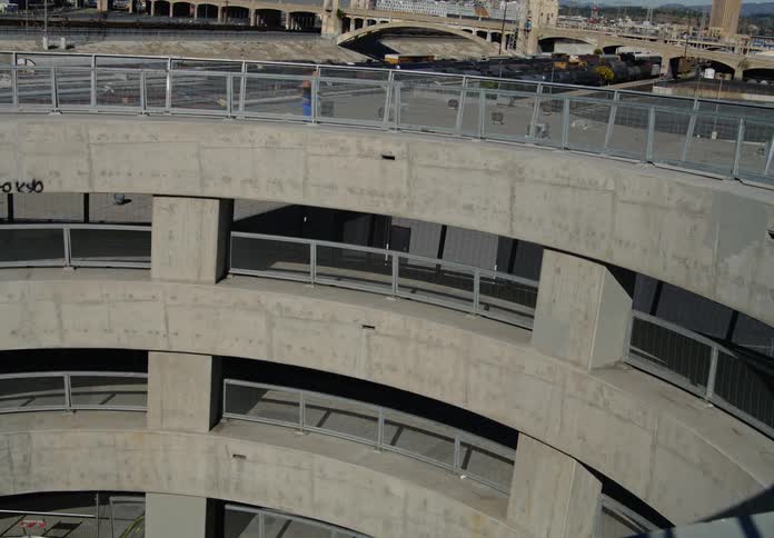 Woman jogging up the ramp of a parking garage