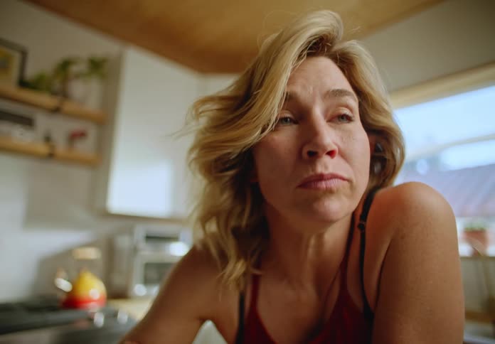A woman eating with a spoon