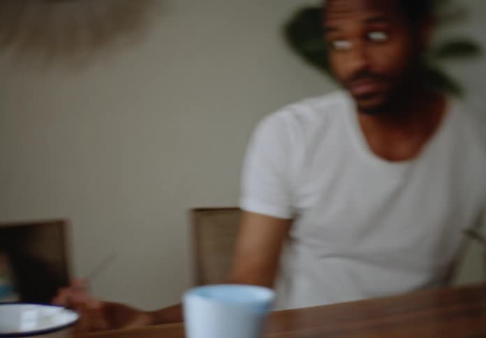 A father catches his son eating candy for breakfast