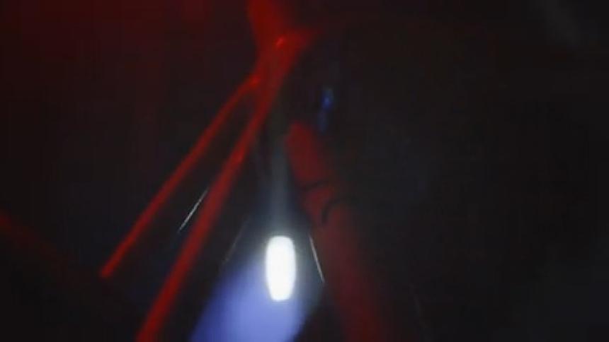 A person is riding their bike at night