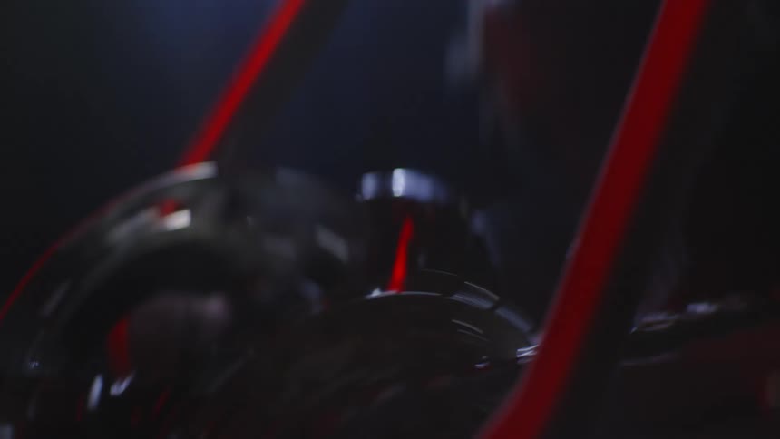 Close up on the bearing of a moving bicycle at night