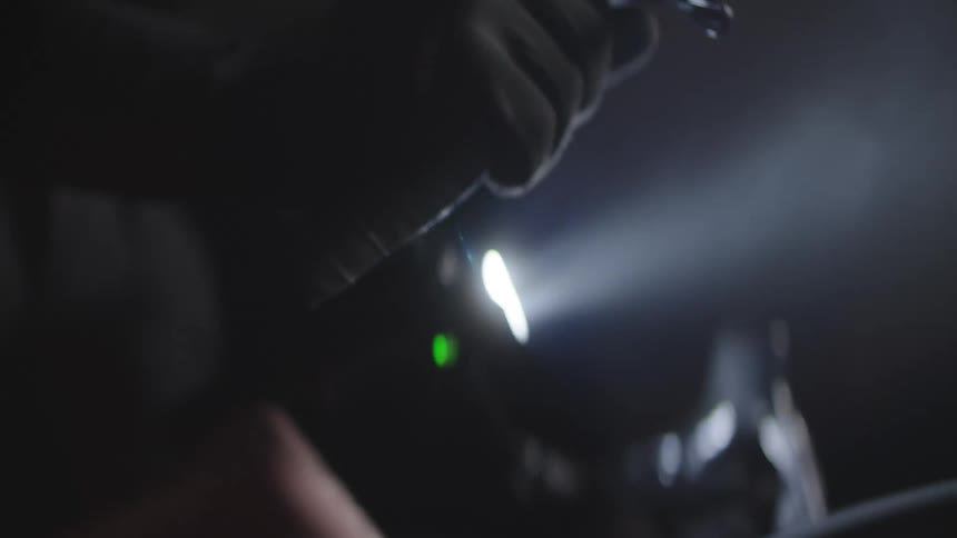 Closeup of a persons feet cycling at night at high speed