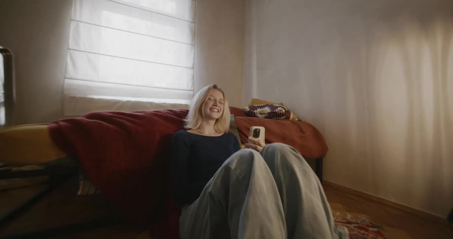 A clip of a lady laughing in the room
