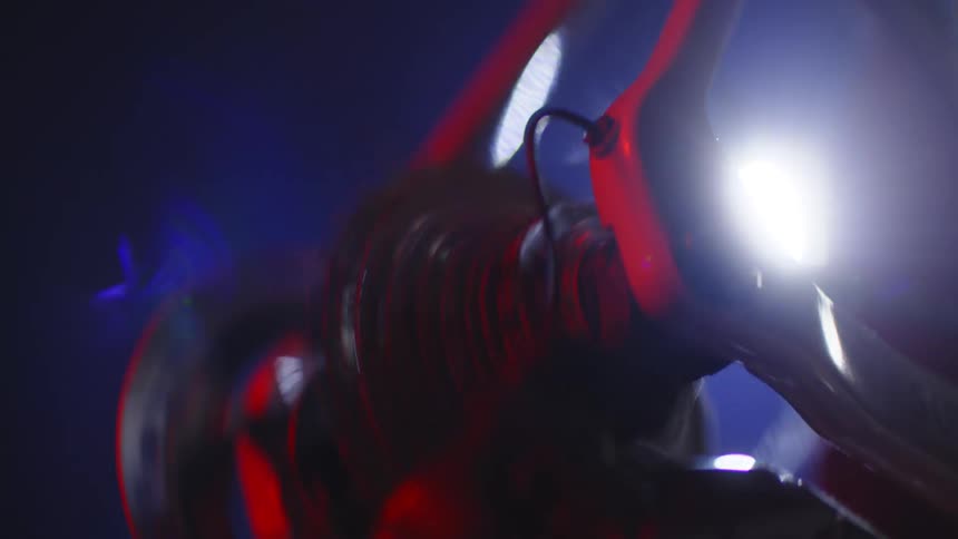 The bicycle wheel turns at night