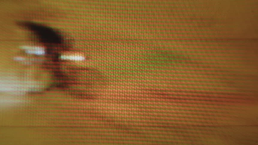 Video of a person on a bicycle passing at high speed at night