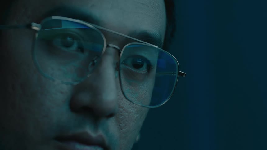 Portrait of a man with glasses looking focused