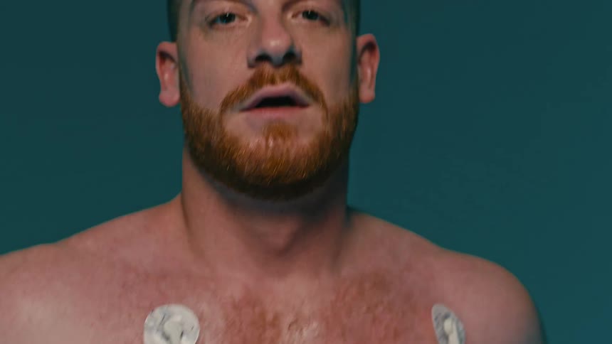 Wires are attached to the man during a stress test